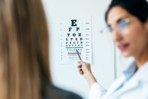 Eye doctor conducting an eye exam.