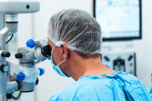 A cataract surgeon doing a cataract eye surgery procedure.