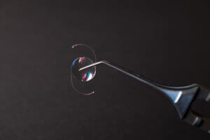 Lens IOL for treating cataract infront of surgeon eye